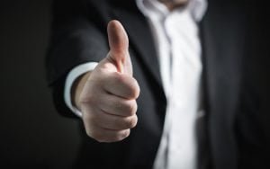 cash for house offer approved with a thumbs up sign