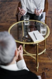 discuss buy my house options with a friend over drinks