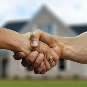 Men shaking hands upon sell my home fast