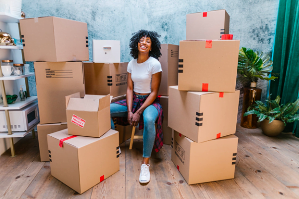 woman with moving boxes ready for a fresh start