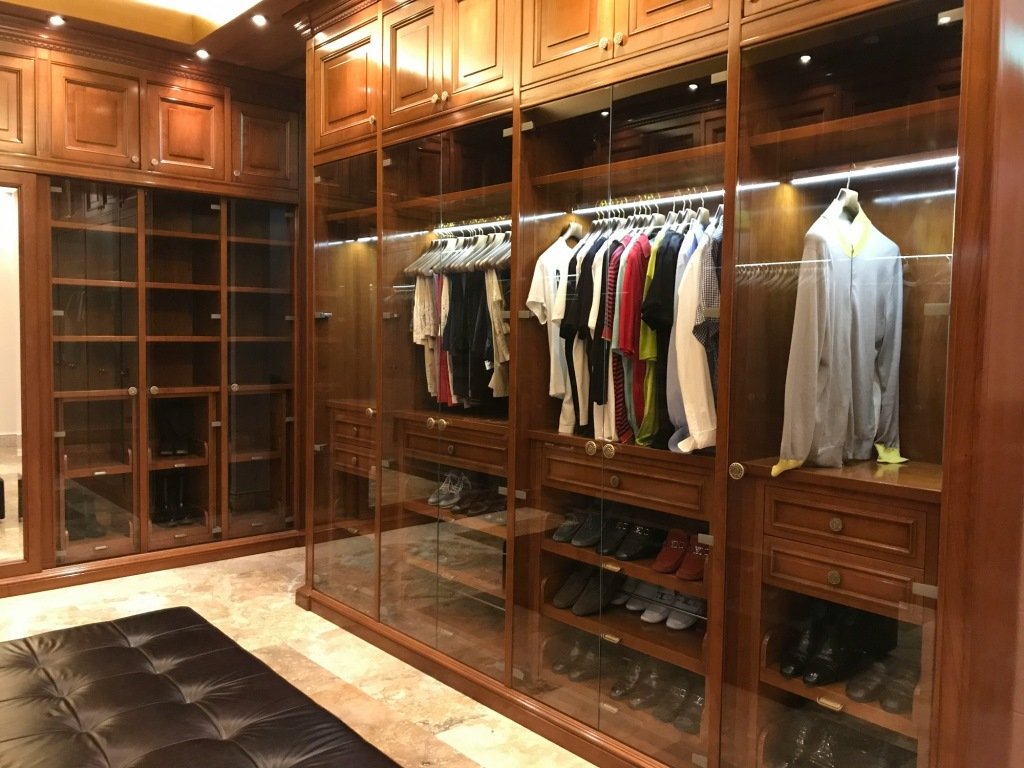 Traditional custom closet with warm wood 