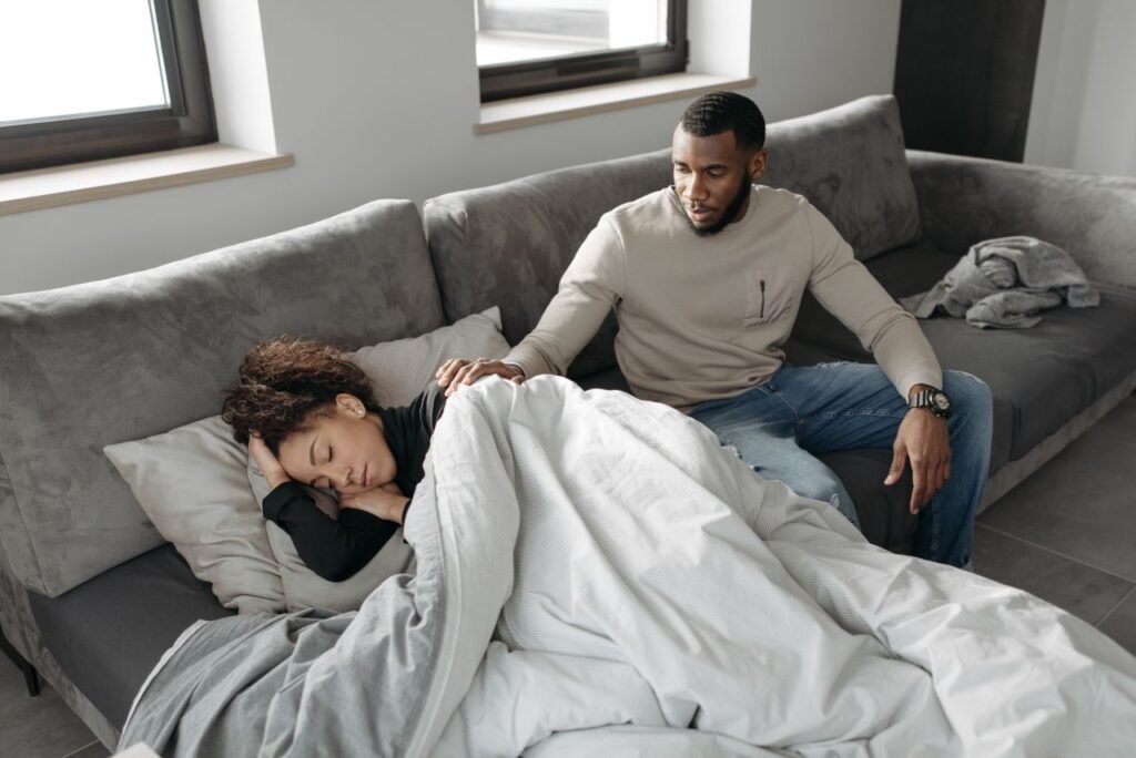husband comforts chronically ill wife 